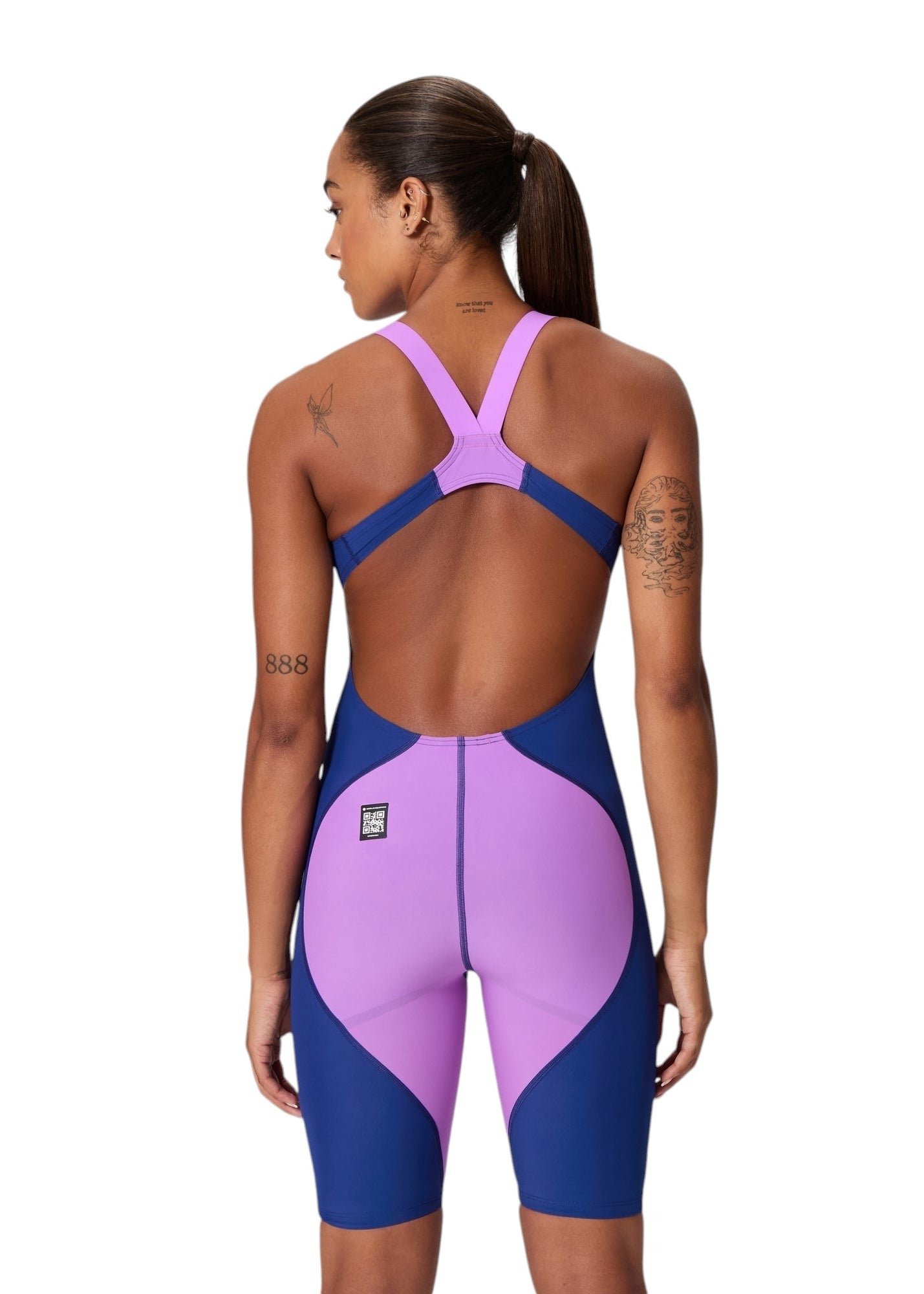 Speedo LZR Pro 2.0 Kneeskin: Back view. Features navy side panels, lavender V-straps, and a large lavender rear panel. World Aquatics-approved QR logo included.